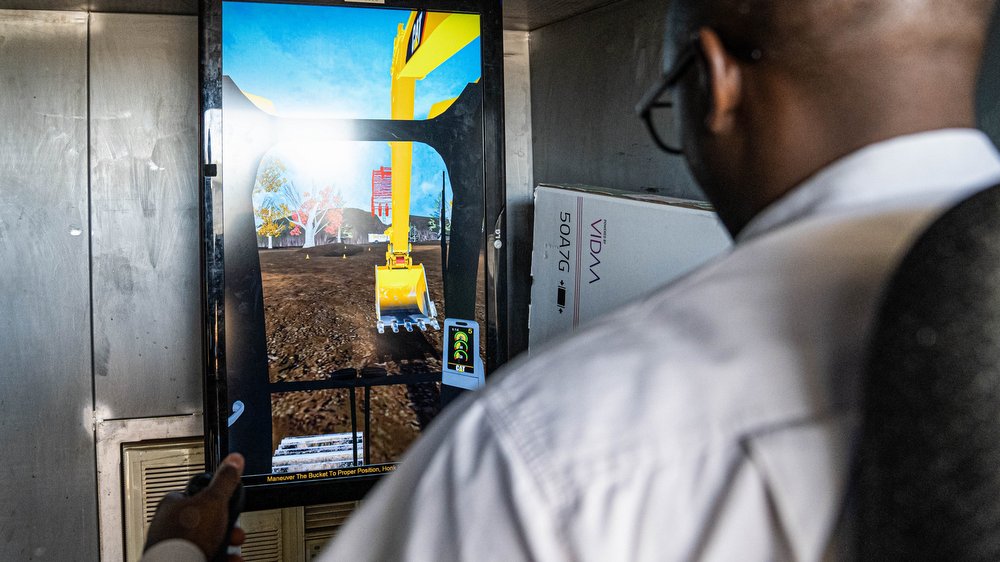 Jacob Khumalo, General Manager – Commercial, tries his hand at the excavator simulator.