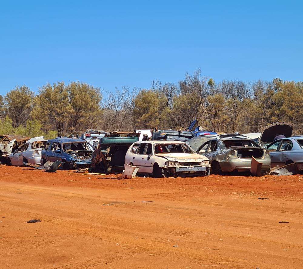 The abandoned cars that have been moved to the landfill.