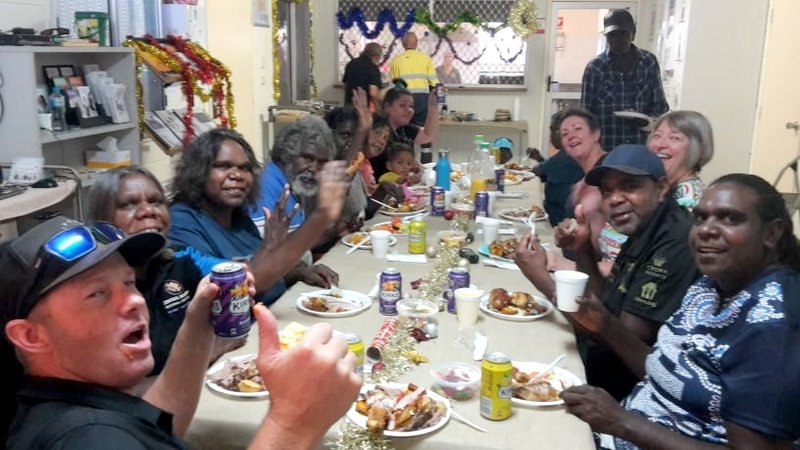 Staff and families enjoying an early Christmas lunch.