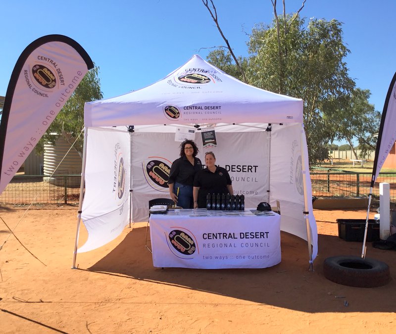 Natassia Ludowyke and Sarah Bindle working the Laramba CDP pop-up stand