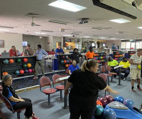 The team bowling as a team building exercise.