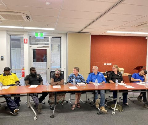 Greg Corbett discussing the training while Richard Glenn, Rebecca Numina, Michael McCarron, Mark Francis, Kathryn Boynton and Bayudin Basarudin listen. 